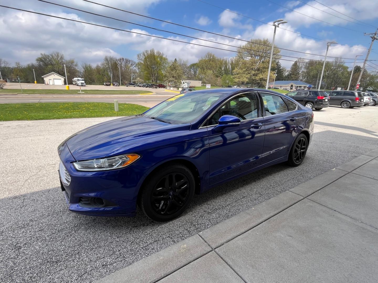 2014 Deep Impact Blue Ford Fusion SE (1FA6P0HD9E5) with an 1.5L L4 DOHC 16V engine, located at 1633 W Kimberly, Davenport, IA, 52806, (563) 323-5341, 41.559456, -90.598732 - Photo#2