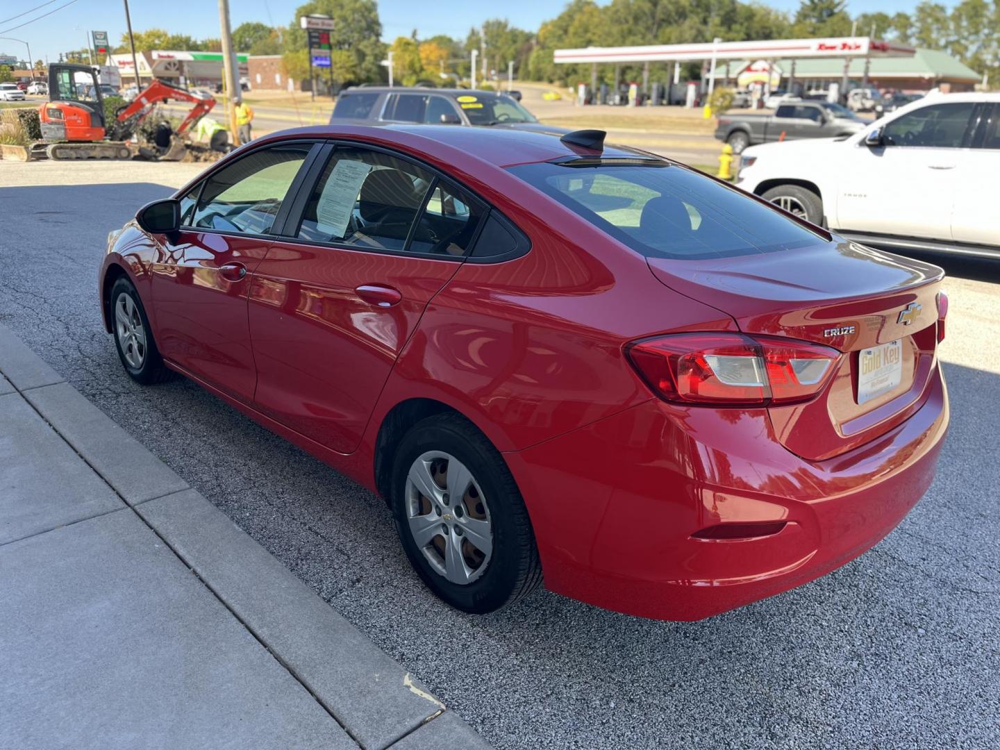 2018 Red Chevrolet Cruze LS Auto (1G1BC5SM8J7) with an 1.4L L4 DOHC 16V TUR engine, 6-Speed Automatic transmission, located at 1633 W Kimberly, Davenport, IA, 52806, (563) 323-5341, 41.559456, -90.598732 - Photo#3