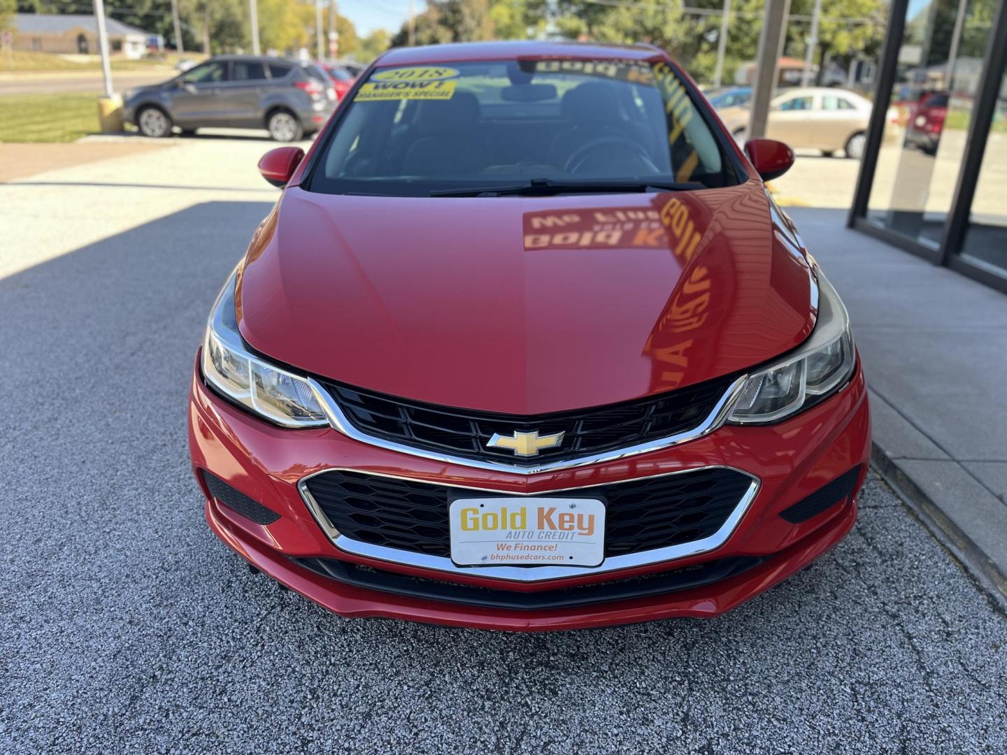 2018 Red Chevrolet Cruze LS Auto (1G1BC5SM8J7) with an 1.4L L4 DOHC 16V TUR engine, 6-Speed Automatic transmission, located at 1633 W Kimberly, Davenport, IA, 52806, (563) 323-5341, 41.559456, -90.598732 - Photo#1