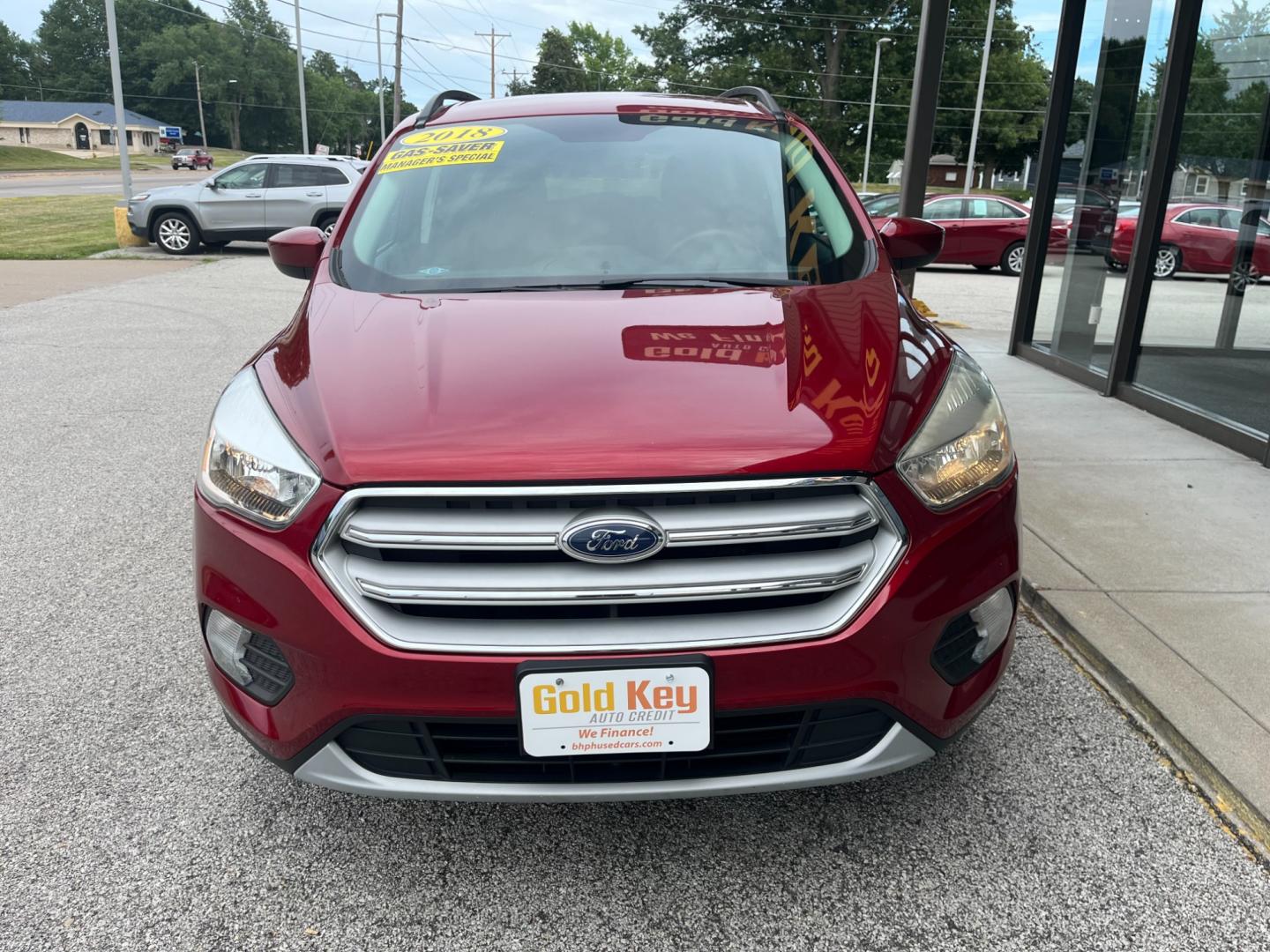 2018 Ruby Red Metallic Tinted Clearcoat Ford Escape SE FWD (1FMCU0GD1JU) with an 1.5L L4 DOHC 16V engine, 6-Speed Automatic transmission, located at 1633 W Kimberly, Davenport, IA, 52806, (563) 323-5341, 41.559456, -90.598732 - Photo#1