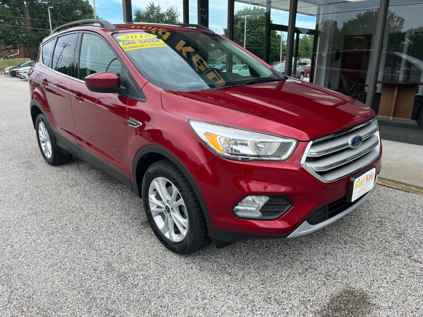 2018 Ruby Red Metallic Tinted Clearcoat Ford Escape SE FWD (1FMCU0GD1JU) with an 1.5L L4 DOHC 16V engine, 6-Speed Automatic transmission, located at 1633 W Kimberly, Davenport, IA, 52806, (563) 323-5341, 41.559456, -90.598732 - Photo#2