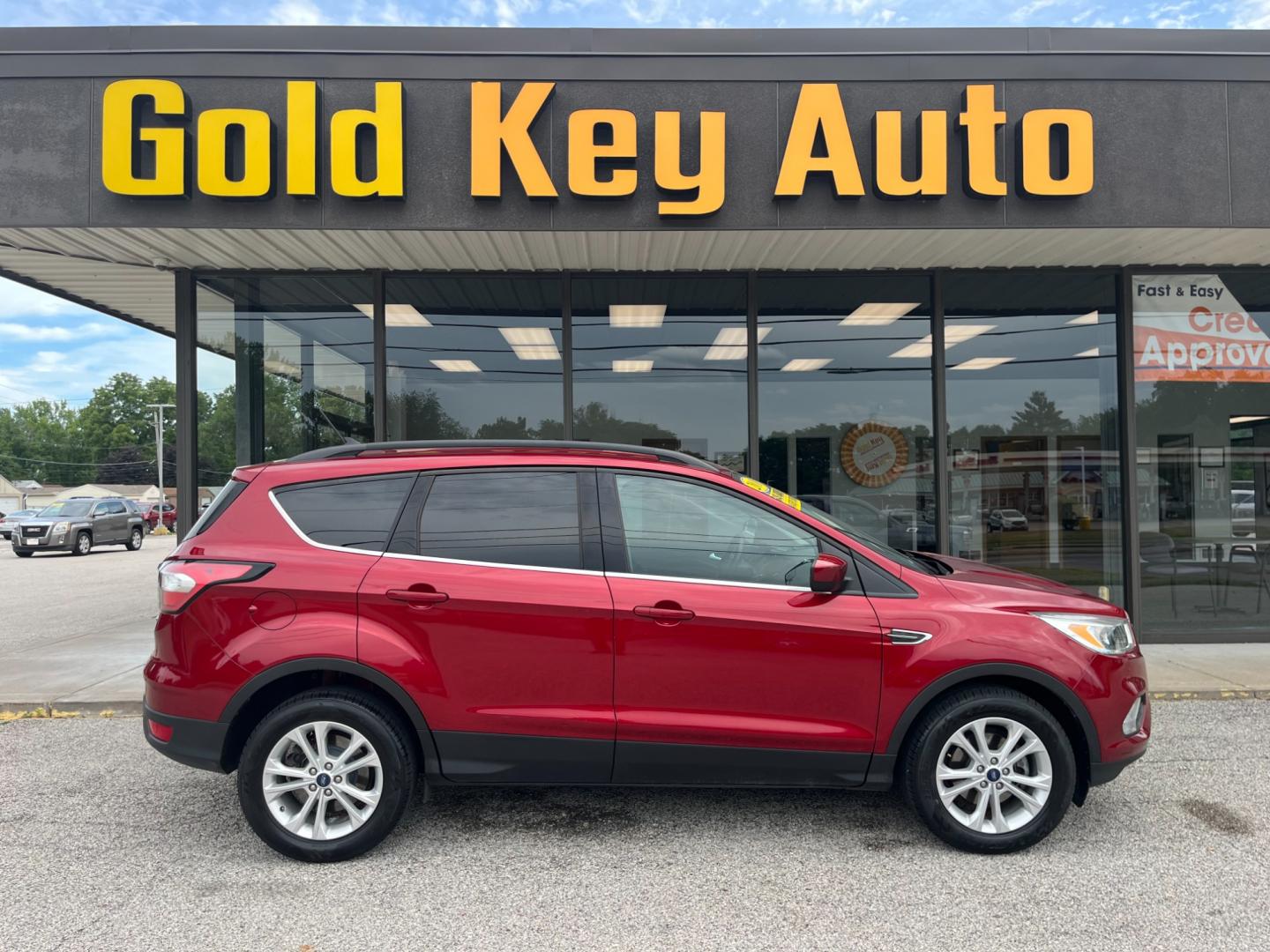 2018 Ruby Red Metallic Tinted Clearcoat Ford Escape SE FWD (1FMCU0GD1JU) with an 1.5L L4 DOHC 16V engine, 6-Speed Automatic transmission, located at 1633 W Kimberly, Davenport, IA, 52806, (563) 323-5341, 41.559456, -90.598732 - Photo#0