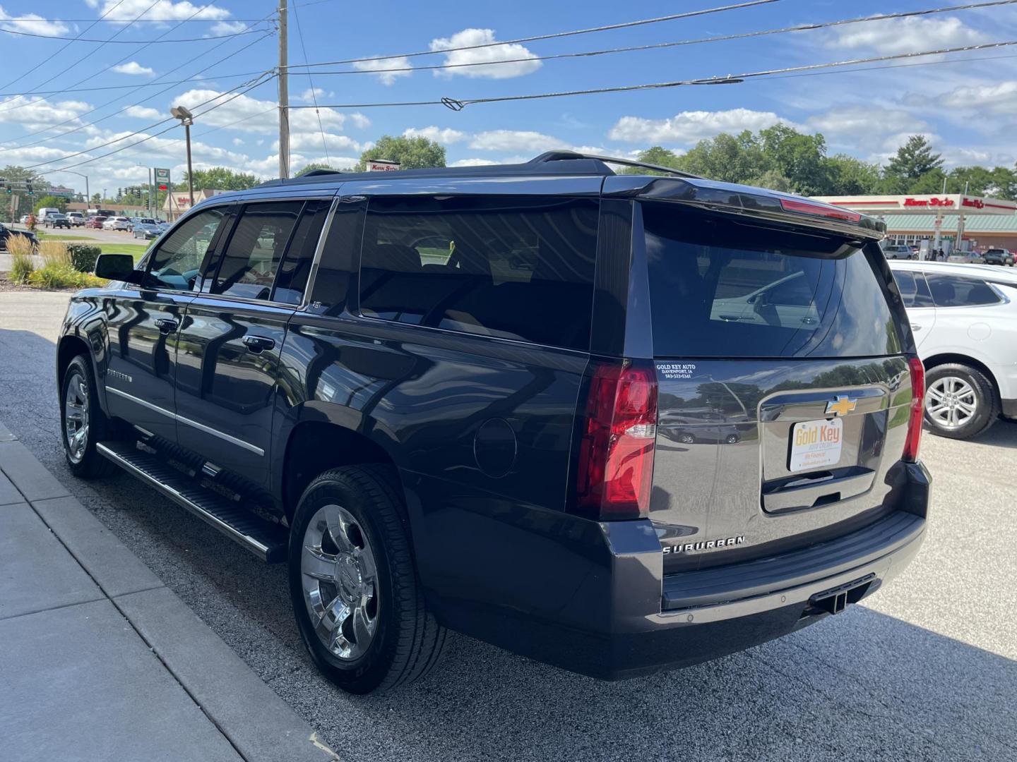 2017 Tungsten Metallic Chevrolet Suburban LT 4WD (1GNSKHKC0HR) with an 5.3L V8 OHV 16V engine, 6-Speed Automatic transmission, located at 1633 W Kimberly, Davenport, IA, 52806, (563) 323-5341, 41.559456, -90.598732 - Photo#3