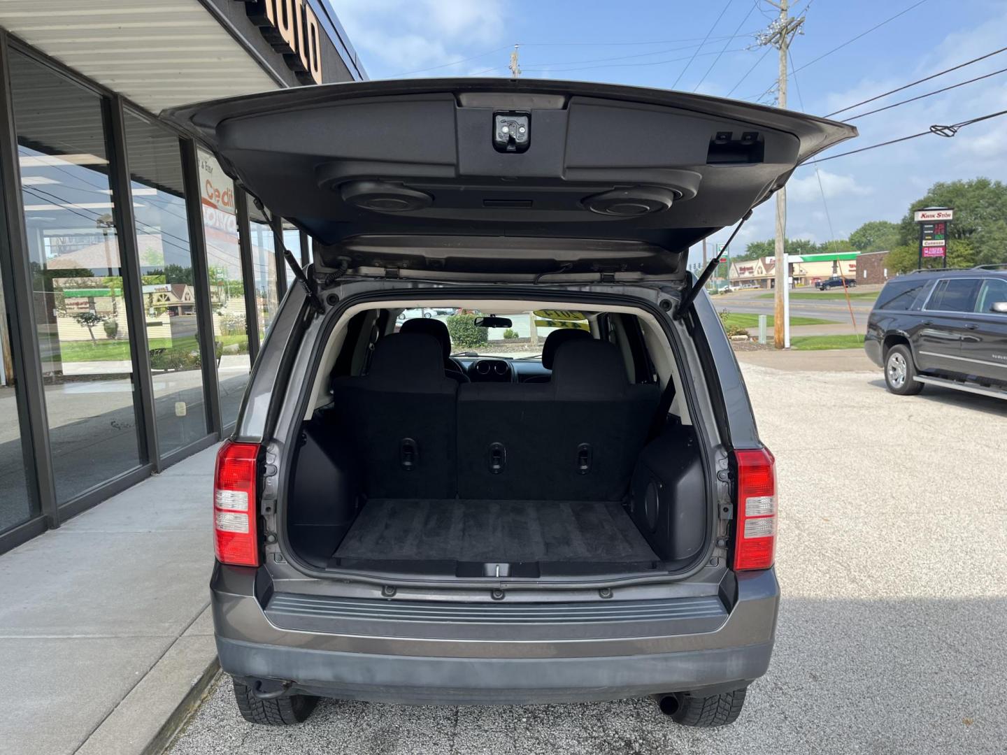 2014 Granite Crystal Met CC Jeep Patriot Latitude 4WD (1C4NJRFB8ED) with an 2.4L L4 DOHC 16V engine, located at 1633 W Kimberly, Davenport, IA, 52806, (563) 323-5341, 41.559456, -90.598732 - Photo#5