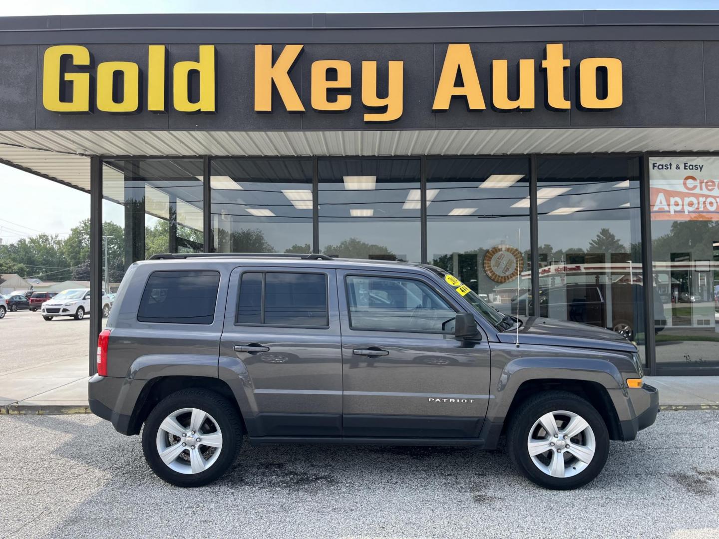 2014 Granite Crystal Met CC Jeep Patriot Latitude 4WD (1C4NJRFB8ED) with an 2.4L L4 DOHC 16V engine, located at 1633 W Kimberly, Davenport, IA, 52806, (563) 323-5341, 41.559456, -90.598732 - Photo#0