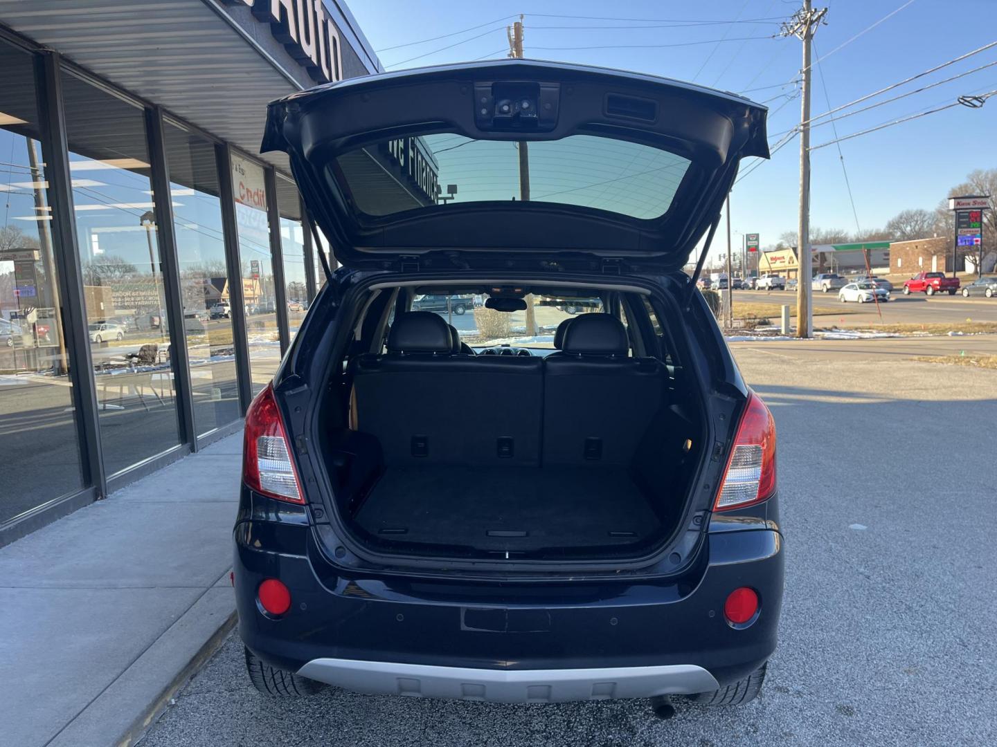 2014 Black Chevrolet Captiva Sport LTZ FWD (3GNAL4EK0ES) with an 2.4L L4 DOHC 16V FFV engine, 6-Speed Automatic transmission, located at 1633 W Kimberly, Davenport, IA, 52806, (563) 323-5341, 41.559456, -90.598732 - Photo#5