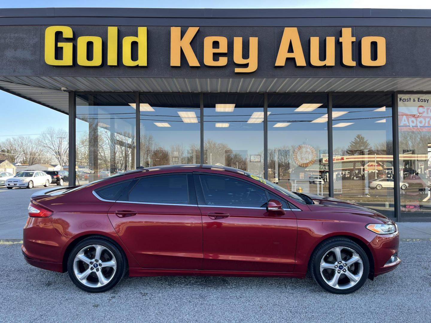 2013 Ruby Red Met Tinted CC Ford Fusion SE (3FA6P0H73DR) with an 2.5L L4 DOHC 16V engine, located at 1633 W Kimberly, Davenport, IA, 52806, (563) 323-5341, 41.559456, -90.598732 - Photo#0