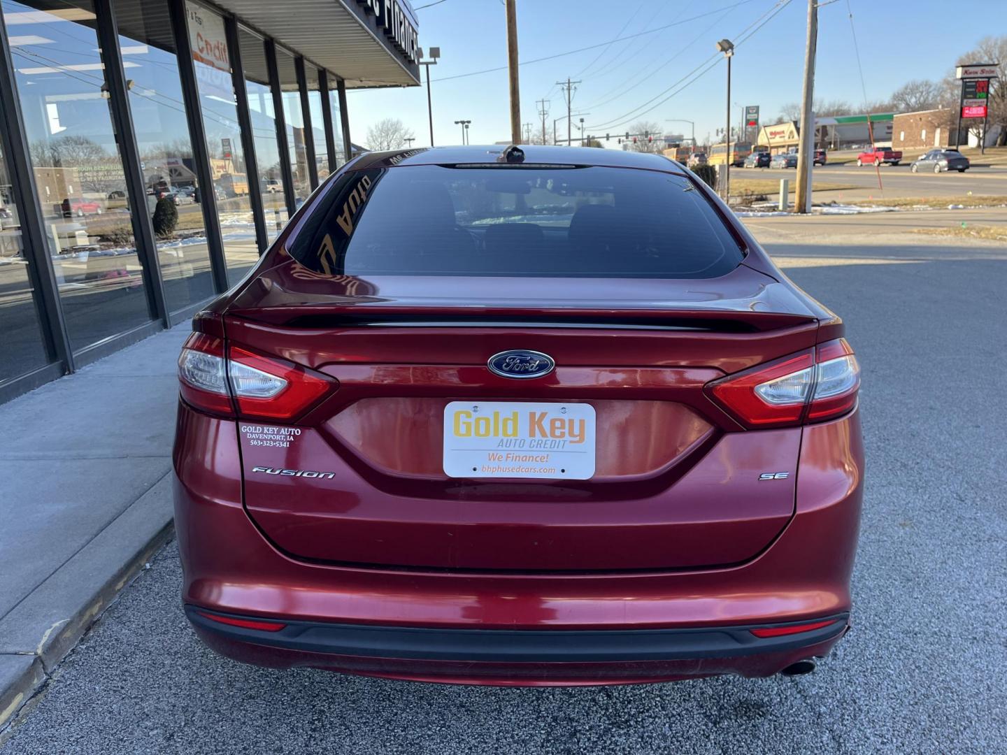 2013 Ruby Red Met Tinted CC Ford Fusion SE (3FA6P0H73DR) with an 2.5L L4 DOHC 16V engine, located at 1633 W Kimberly, Davenport, IA, 52806, (563) 323-5341, 41.559456, -90.598732 - Photo#4