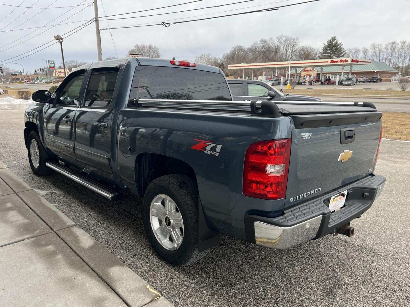 2013 Blue Granite Metallic Chevrolet Silverado 1500 LTZ (3GCPKTE77DG) with an Vortec 5.3L V-8 variable valve control engine, located at 1633 W Kimberly, Davenport, IA, 52806, (563) 323-5341, 41.559456, -90.598732 - Photo#4